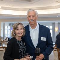 Steve Korc and woman standing and smiling for photo
